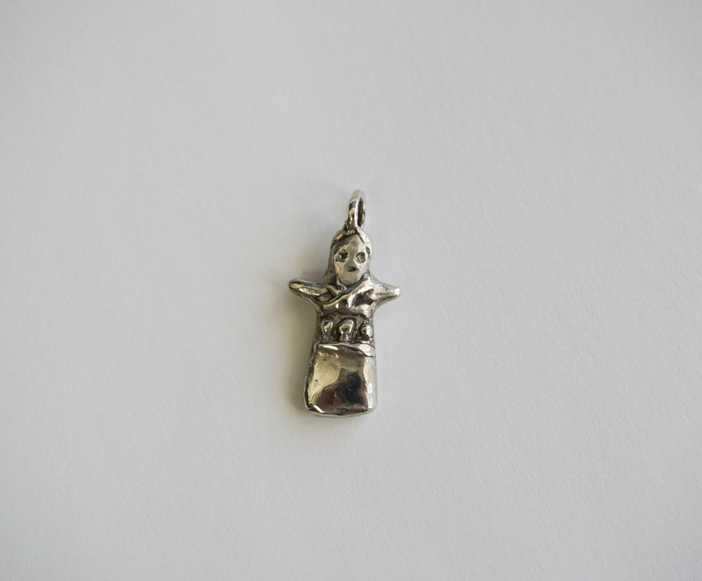 silver worry doll